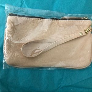 Brown women’s wristlet bag